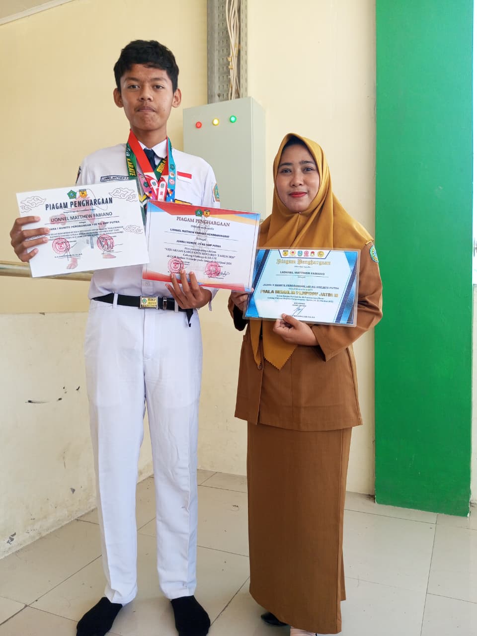 Juara 1 kumite Perorangan -70 kg SMP Putra